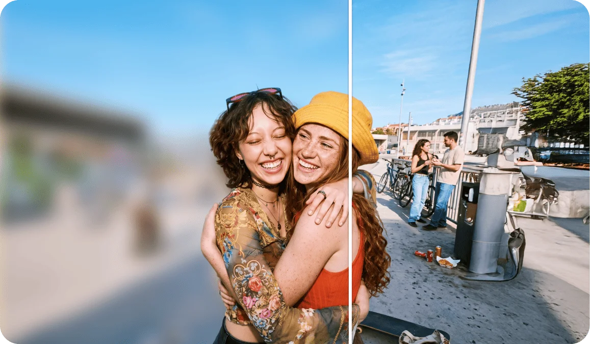 Side-by-side comparison of two young women hugging and laughing outdoors near a waterfront, showing original and blur background effect